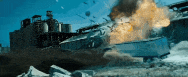 a large explosion is taking place in front of a building with the number 25 on the top of it