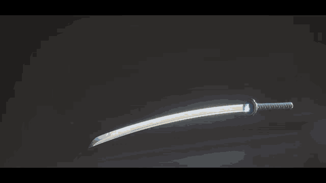 a sword with a blue flame coming out of it 's blade