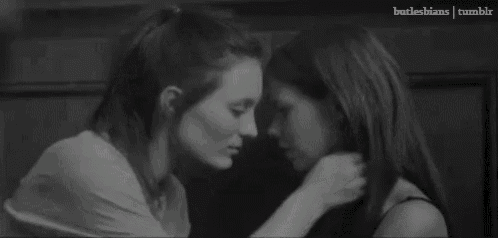 a black and white photo of two women kissing with the words butlesbians tumblr in the corner