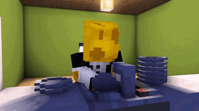 a minecraft character is sitting at a desk with a yellow block on his head