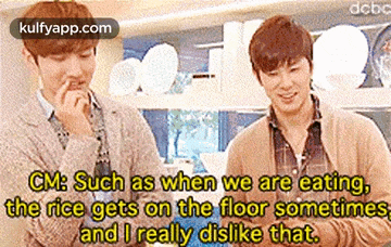 two men are standing next to each other in a kitchen and one of them is eating rice on the floor sometimes .