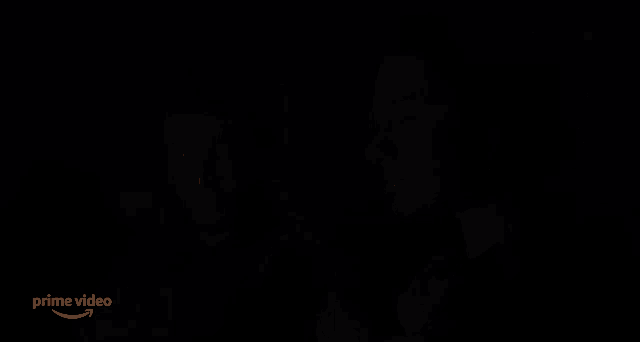 a man and a woman are sitting next to each other and the word no is on the screen