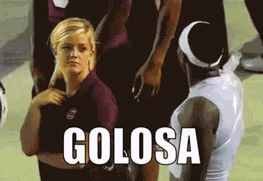 a woman stands in front of a football player with the word golosa written in white