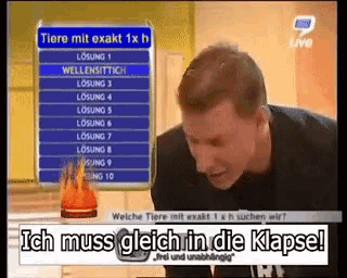 a man is looking at a sign that says tiere mit exakt 1 x h