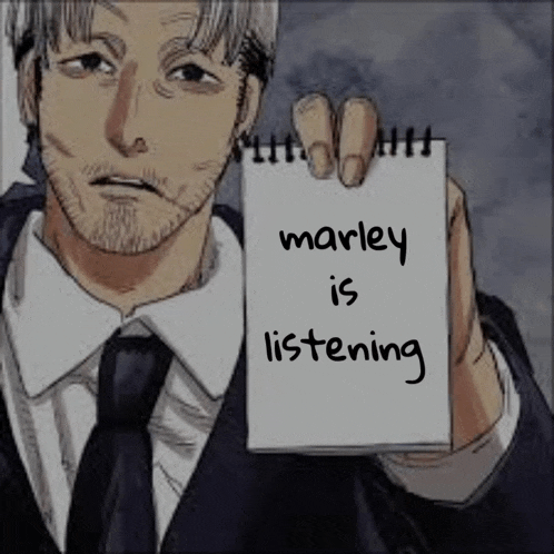 a man in a suit and tie is holding a piece of paper that says marley is listening .