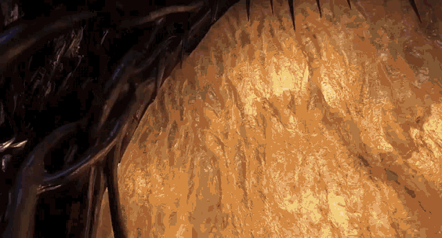 a close up of a cave with a light shining through the walls