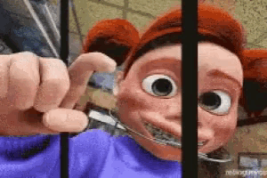 a cartoon character with red hair and braces on her teeth behind bars