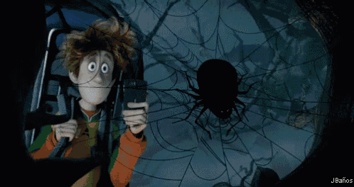 a cartoon character is looking at a spider with a skull on it 's head