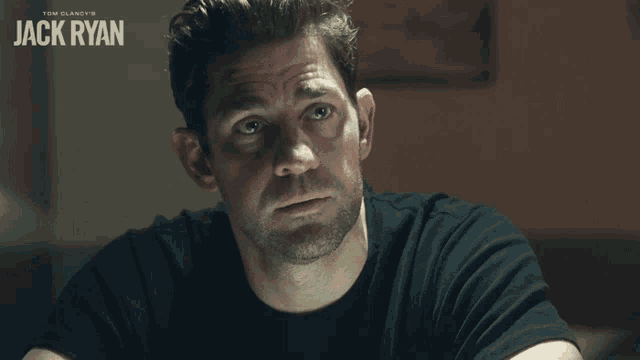 a close up of a man 's face with the name jack ryan on the bottom