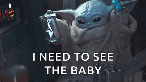 a baby yoda from star wars is sitting in a chair holding a toothbrush and says `` i need to see the baby ''