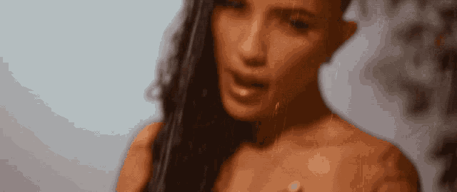 a close up of a woman 's face with long hair