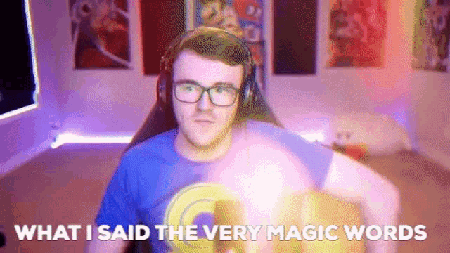 a man wearing glasses and headphones says " what i said the very magic words " in front of him