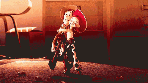 woody and jessie from toy story hugging each other in a dark room