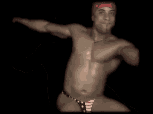 a shirtless man with a red bandana on his head is dancing