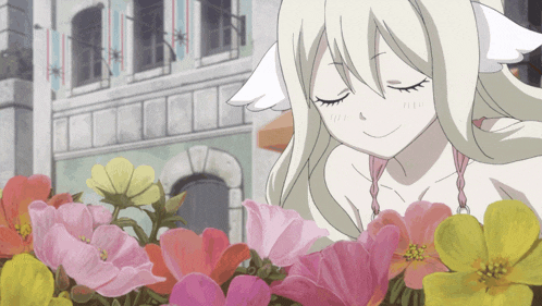 a girl is smelling a bunch of flowers with her eyes closed