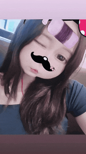 a girl with a fake mustache on her nose