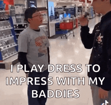 a man is talking into a microphone in a store while another man stands behind him .