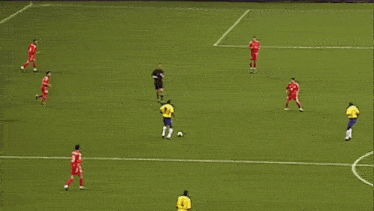a soccer game is being played in front of a budweiser advertisement