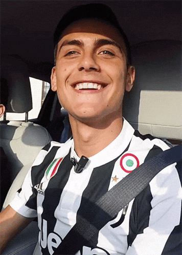 a young man wearing a black and white striped shirt with the word jeep on it