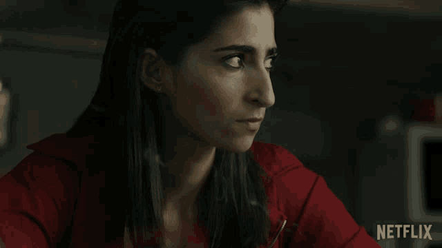 a close up of a woman 's face with a netflix logo in the corner