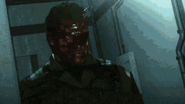 a man with blood on his face stands in a hallway