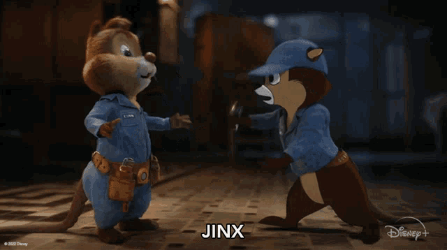 two chipmunks are standing next to each other and the word jinx is on the bottom right