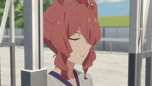 a close up of a girl with red hair