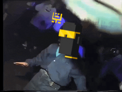 a pixelated image of a person with a yellow e on their face