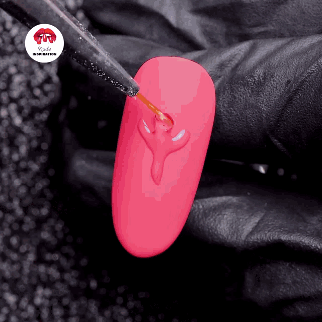 a close up of a pink nail with the words nails inspiration written on the bottom