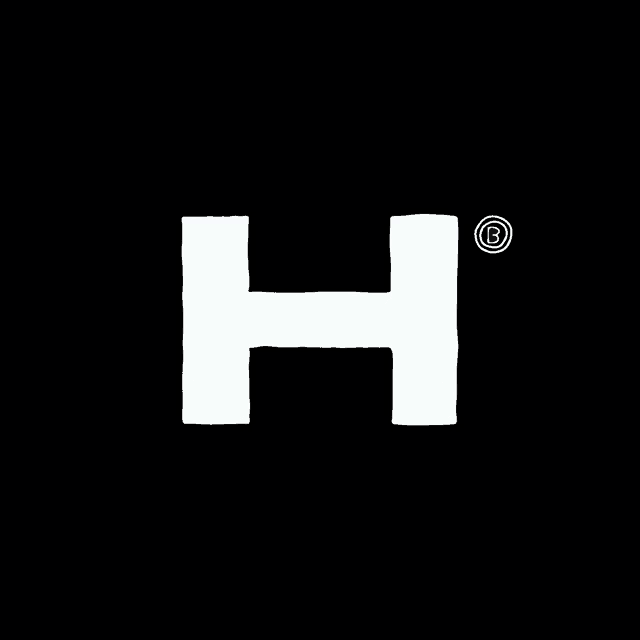 a white letter h with a circle around it on a black background