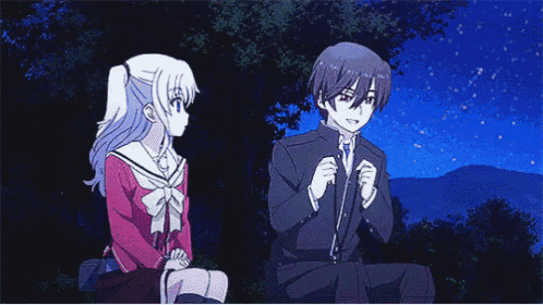a boy and a girl are sitting next to each other in front of a starry sky