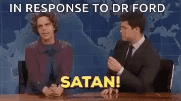 a man and a woman are sitting at a table with the words `` in response to dr ford satan '' written on the bottom .