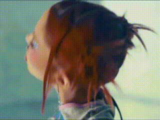 a close up of a person 's head with a bun