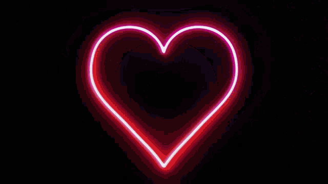 a neon sign that looks like a broken heart with a lightning bolt in the middle