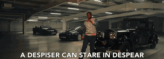 a despiser can stare in despear is written above a man standing next to a car