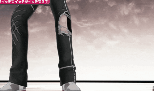a person wearing a pair of ripped jeans with chinese writing behind them