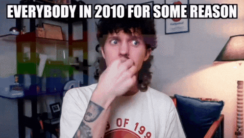 a man with a tattoo on his arm is covering his nose with his hand while wearing a shirt that says of 198