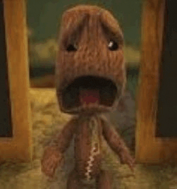 a stuffed animal is standing in front of a door with his mouth open .