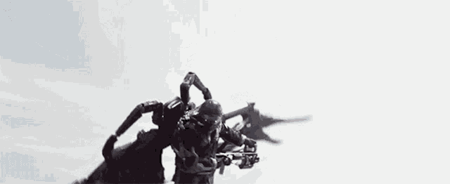 a statue of a man flying through the air .