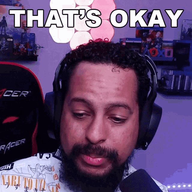 a man wearing headphones says " that 's okay " on the screen