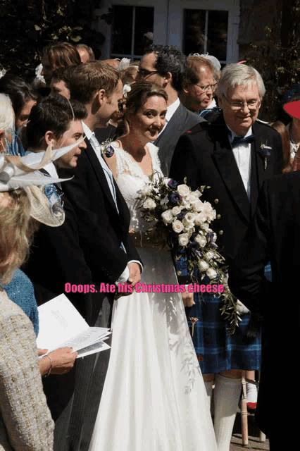 a bride and groom are standing in front of a crowd with the caption ooops at this christmas cheese