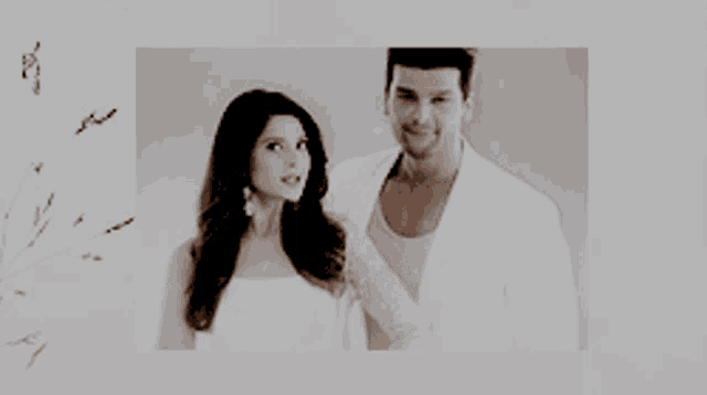 a man and a woman standing next to each other on a white background
