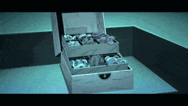 a box filled with a variety of items including buttons and beads