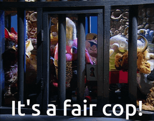 a group of stuffed animals in a cage with the words " it 's a fair cop " above them
