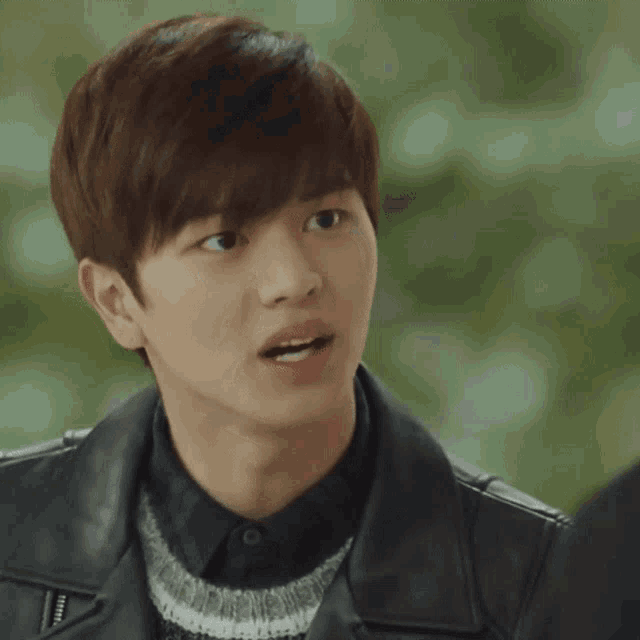 a young man wearing a leather jacket is talking to someone and says `` don 't you feel it ''