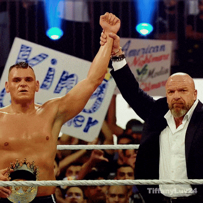 two men in a boxing ring with a sign in the background that says ' king '