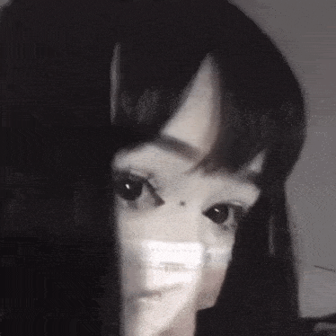a black and white photo of a woman wearing a mask .
