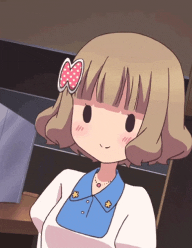a girl with brown hair and a pink bow on her head