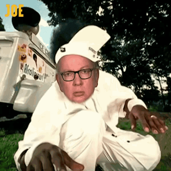 a man kneeling in front of an ice cream truck with the word joe written on it