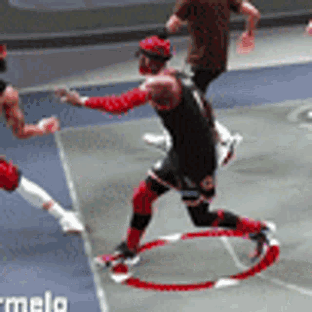 a group of men are playing a game of basketball on a court ..